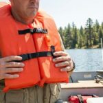 how to wear a life jacket with a fishing vest